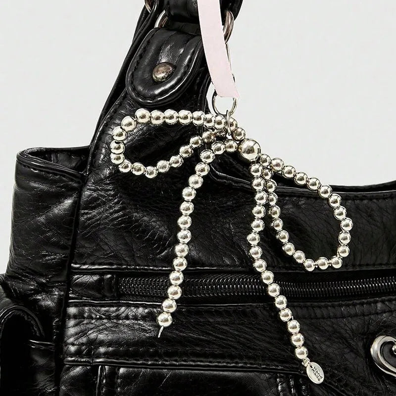 Fashionable handbag with bow pendant, niche design, large capacity women's armpit bag, suitable for commuting to work, shopping,